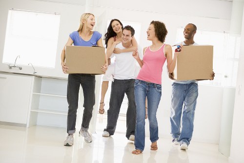 Professional house removals in Soho with moving van in a busy London street