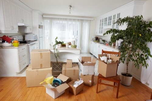 Boxes and protected furniture being unloaded at a Soho property