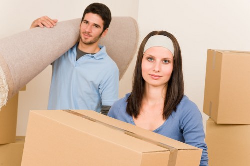 Stacked boxes and labelled storage items in a unit